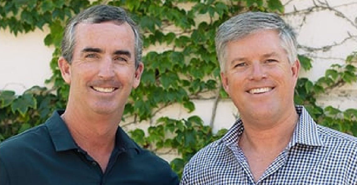 ADS founders standing outside smiling