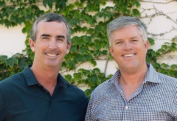 ADS founders standing outside smiling