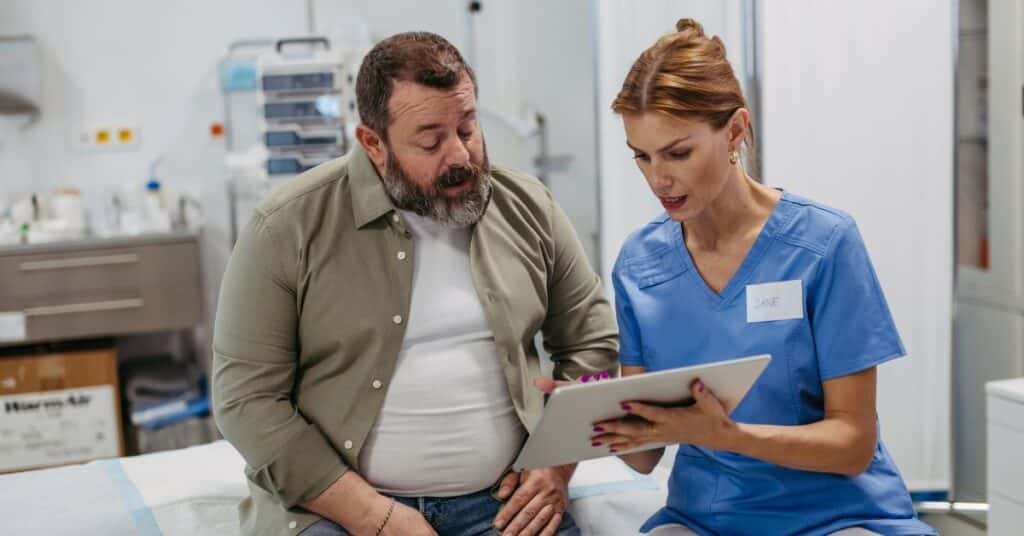A nurse goes over questions about bariatric surgery for type 2 diabetes with a patient.