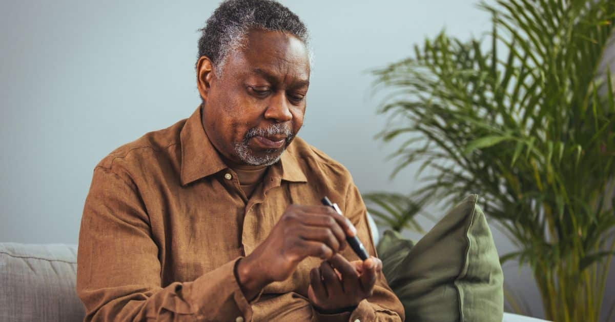 man fingerstick testing